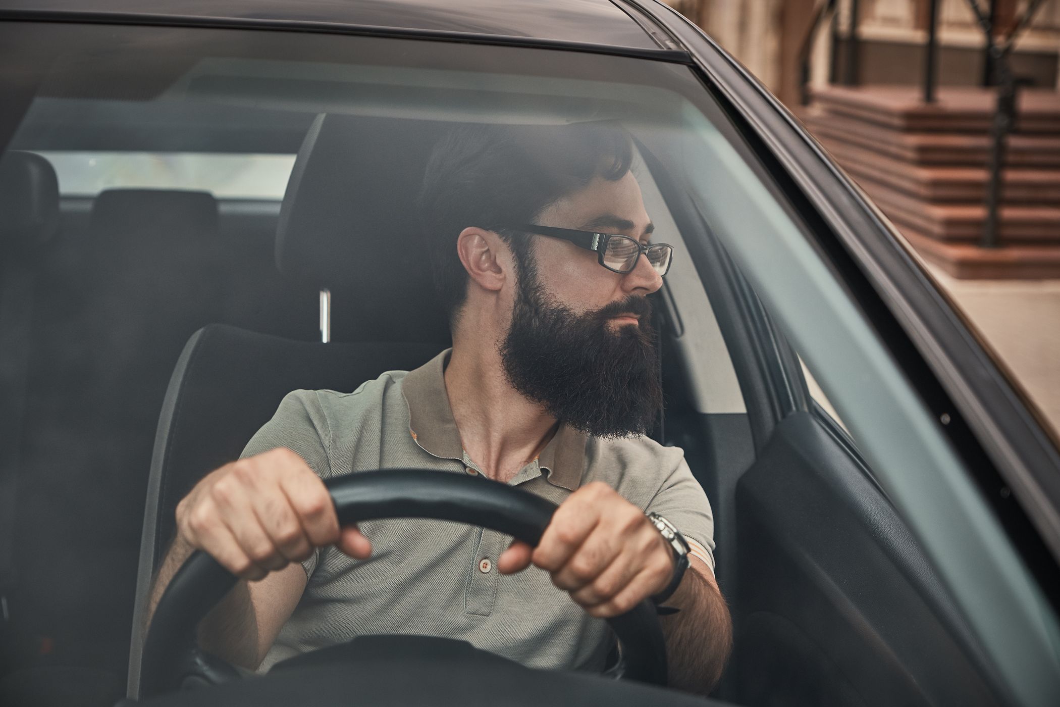 a-modern-bearded-man-driving-a-car-EUHRNQA.jpg